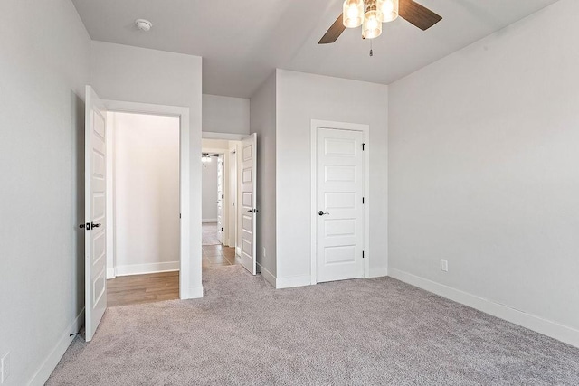 901 Carlock Dr, Pea Ridge, AR 72751 - unfurnished bedroom featuring carpet, baseboards, and ceiling fan
