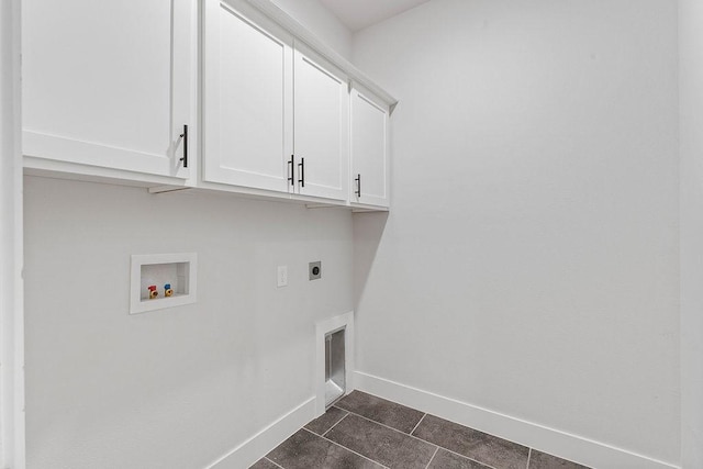 901 Carlock Dr, Pea Ridge, AR 72751 - laundry area featuring cabinet space, hookup for an electric dryer, baseboards, hookup for a washing machine, and dark tile patterned flooring