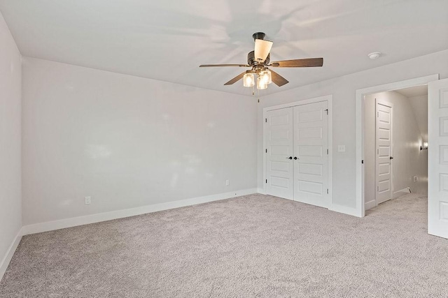 901 Carlock Dr, Pea Ridge, AR 72751 - unfurnished bedroom featuring light colored carpet, baseboards, a closet, and ceiling fan