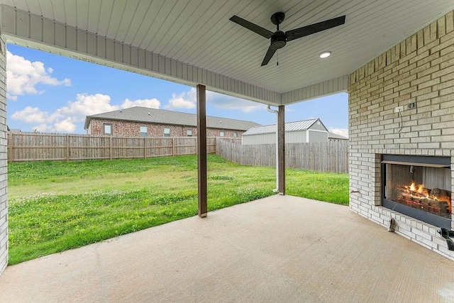 901 Carlock Dr, Pea Ridge, AR 72751 - view of patio / terrace featuring an outdoor brick fireplace and a ceiling fan