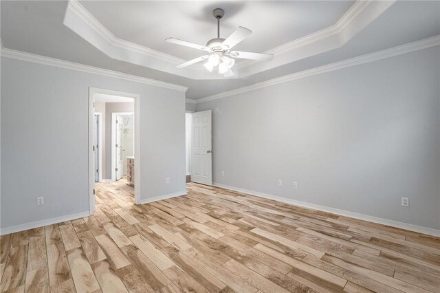 301 Halleck Coach Rd, Centerton, AR 72719 - unfurnished room featuring a tray ceiling, light wood-type flooring, a ceiling fan, crown molding, and baseboards