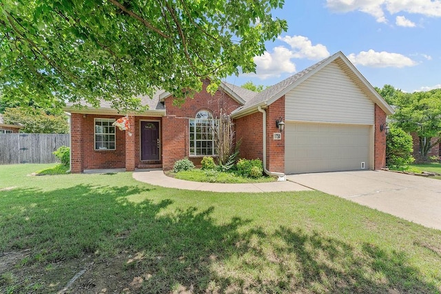 1750 Lancaster Dr, Springdale, AR 72762 - view of front of house featuring an attached garage, brick siding, driveway, and roof with shingles