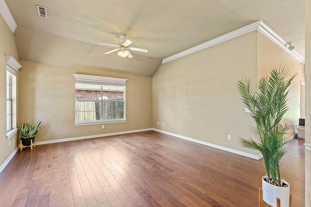 1750 Lancaster Dr, Springdale, AR 72762 - spare room with a ceiling fan, ornamental molding, vaulted ceiling, baseboards, and wood finished floors