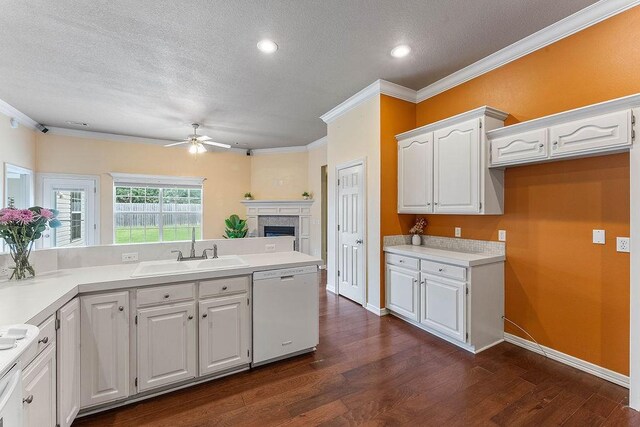 1750 Lancaster Dr, Springdale, AR 72762 - kitchen featuring white dishwasher, a sink, ceiling fan, a textured ceiling, and white cabinetry