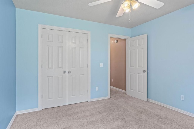 1750 Lancaster Dr, Springdale, AR 72762 - unfurnished bedroom with a closet, carpet, baseboards, and ceiling fan