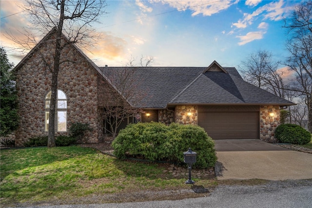 8093 Rockwood Ln, Rogers, AR 72756 - view of front of home featuring roof with shingles, an attached garage, stone siding, concrete driveway, and a front lawn