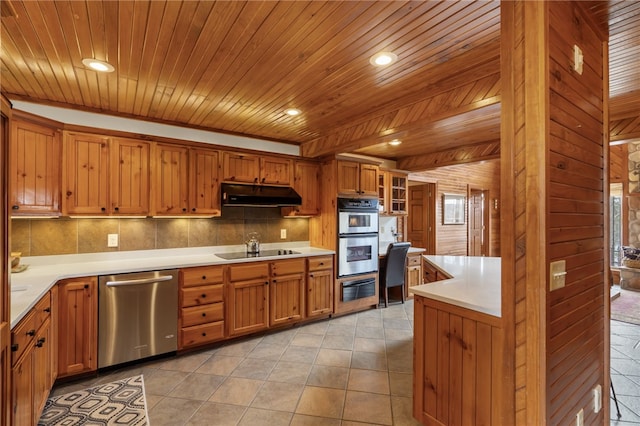 8093 Rockwood Ln, Rogers, AR 72756 - kitchen featuring appliances with stainless steel finishes, a warming drawer, under cabinet range hood, brown cabinetry, and wood ceiling