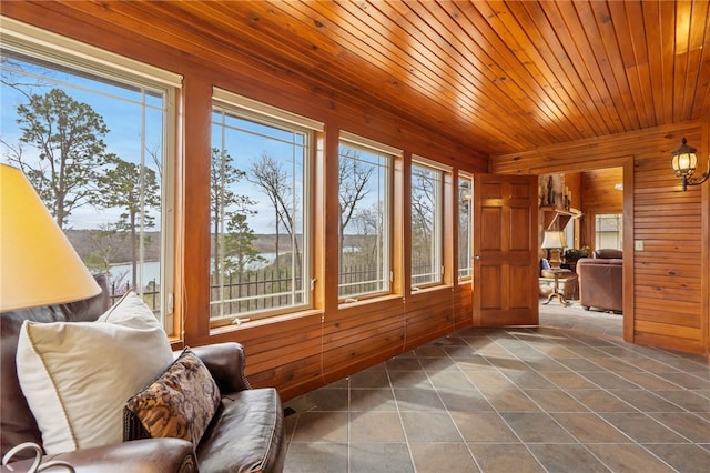 8093 Rockwood Ln, Rogers, AR 72756 - sunroom / solarium with wooden walls, healthy amount of natural light, tile patterned floors, and wood ceiling