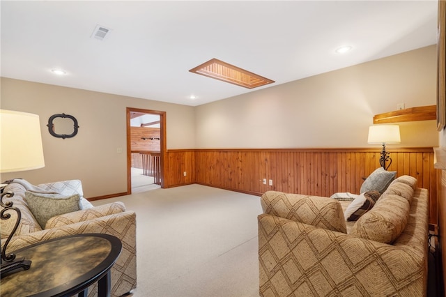 8093 Rockwood Ln, Rogers, AR 72756 - carpeted living area featuring wainscoting, wood walls, and recessed lighting