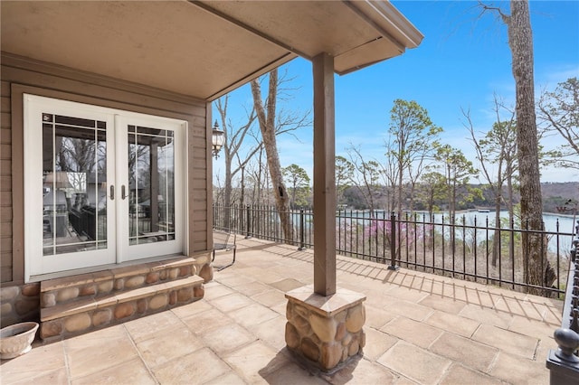 8093 Rockwood Ln, Rogers, AR 72756 - view of patio with french doors and a water view