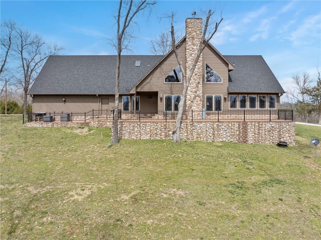 8093 Rockwood Ln, Rogers, AR 72756 - back of house with a chimney, a lawn, roof with shingles, and cooling unit