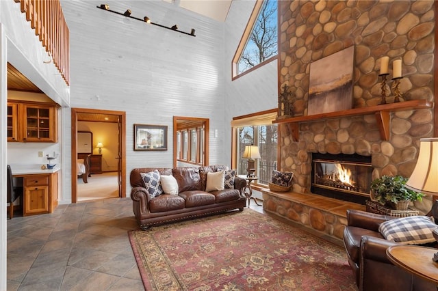 8093 Rockwood Ln, Rogers, AR 72756 - living room featuring a high ceiling and a fireplace