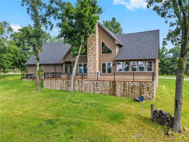 8093 Rockwood Ln, Rogers, AR 72756 - back of house featuring a shingled roof and a yard