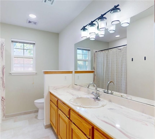 325 Northcrest Ave, Lowell, AR 72745 - bathroom with vanity, toilet, and baseboards