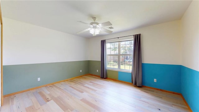 325 Northcrest Ave, Lowell, AR 72745 - empty room with wood finished floors, baseboards, and a ceiling fan