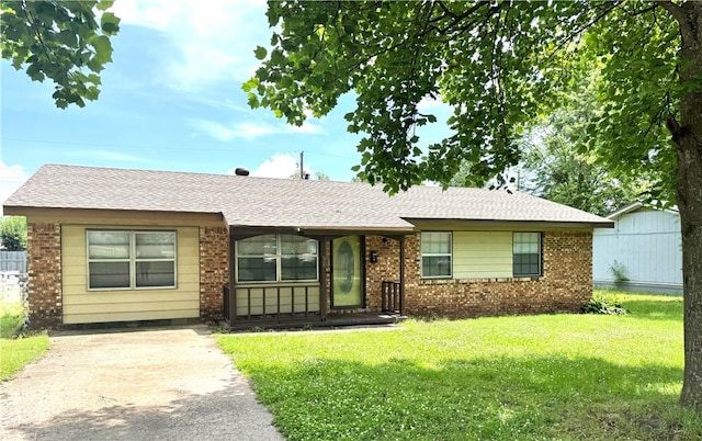 29 5th Ave, Dardanelle, AR 72834 - ranch-style home with brick siding, a front lawn, and a shingled roof