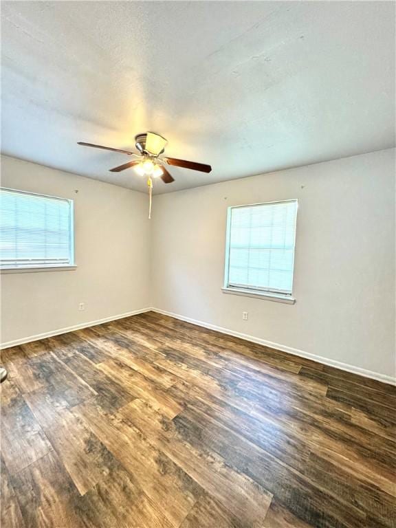 29 5th Ave, Dardanelle, AR 72834 - unfurnished room featuring wood finished floors, ceiling fan, and baseboards