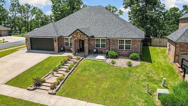 4206 NE Kenton Ave, Bentonville, AR 72712 - view of front of property with a garage, driveway, roof with shingles, and brick siding
