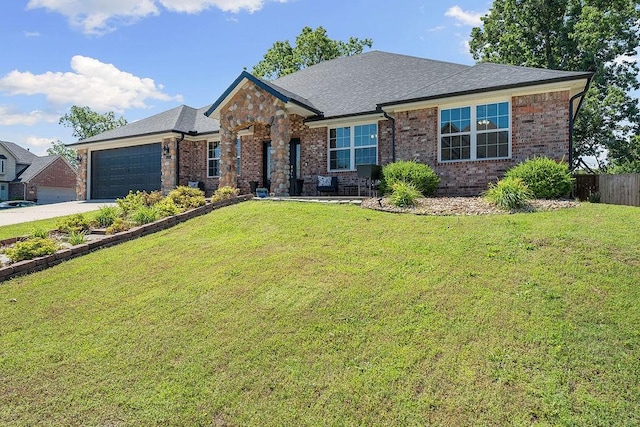 4206 NE Kenton Ave, Bentonville, AR 72712 - view of front facade featuring brick siding, a garage, driveway, and a shingled roof