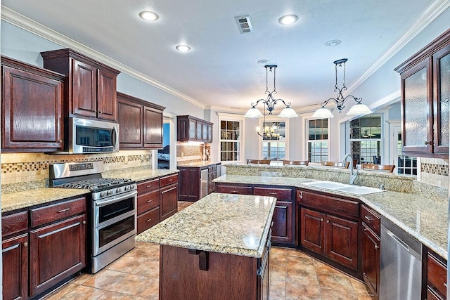 4206 NE Kenton Ave, Bentonville, AR 72712 - kitchen featuring stainless steel appliances, a sink, decorative backsplash, crown molding, and recessed lighting