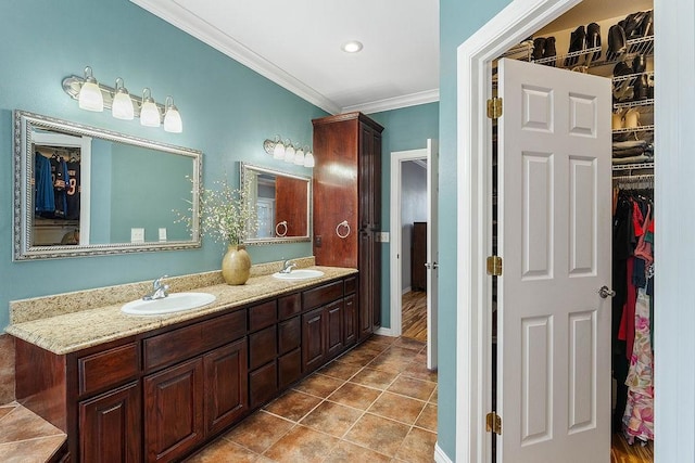 4206 NE Kenton Ave, Bentonville, AR 72712 - full bathroom featuring double vanity, crown molding, a walk in closet, tile patterned floors, and recessed lighting