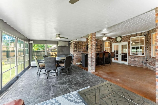 4206 NE Kenton Ave, Bentonville, AR 72712 - sunroom / solarium with french doors, an AC wall unit, and brick wall