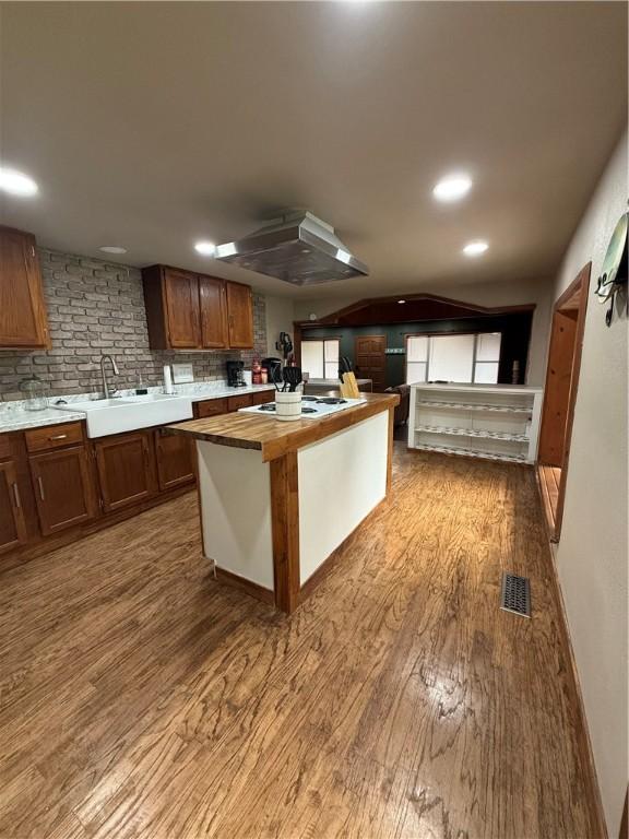 2711 Skyline Dr, Russellville, AR 72802 - kitchen featuring a sink, wood finished floors, butcher block countertops, and white cooktop