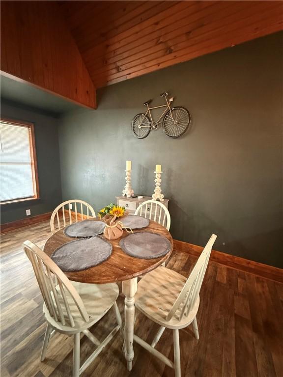 2711 Skyline Dr, Russellville, AR 72802 - dining area with vaulted ceiling, wood finished floors, baseboards, and wooden ceiling