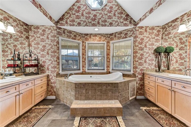 14620 Ravenwood Ln, Garfield, AR 72732 - bathroom featuring plenty of natural light, two vanities, wallpapered walls, tile patterned flooring, and lofted ceiling
