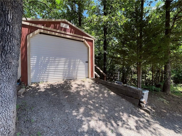 10059 Birdie St, Dardanelle, AR 72834 - detached garage featuring driveway