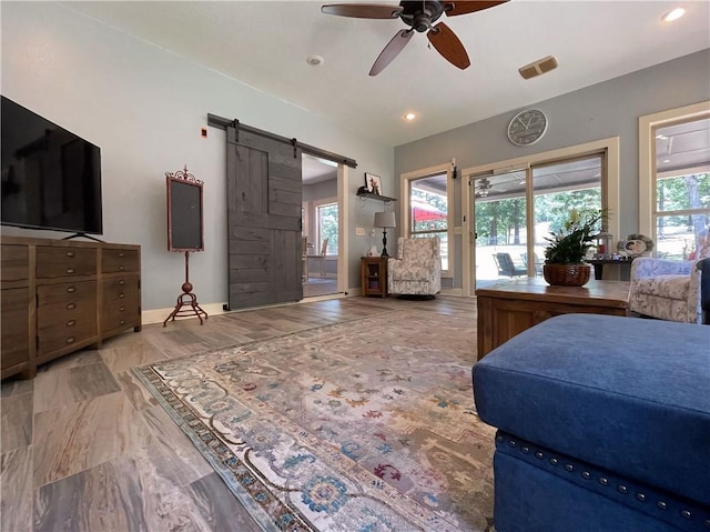 10059 Birdie St, Dardanelle, AR 72834 - bedroom featuring access to outside, a barn door, recessed lighting, a ceiling fan, and baseboards