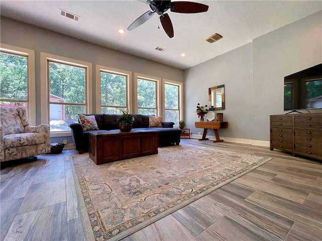 10059 Birdie St, Dardanelle, AR 72834 - living area with plenty of natural light, a ceiling fan, baseboards, recessed lighting, and light wood-style flooring