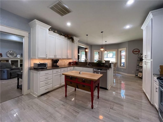 10059 Birdie St, Dardanelle, AR 72834 - kitchen with dishwasher, a peninsula, recessed lighting, white cabinetry, and a sink