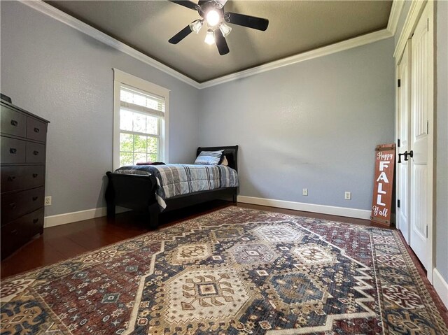 10059 Birdie St, Dardanelle, AR 72834 - bedroom with dark wood-type flooring, ornamental molding, baseboards, and a ceiling fan