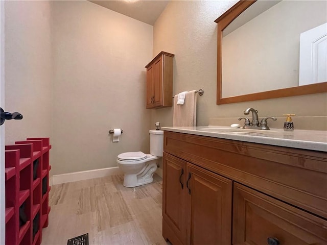 10059 Birdie St, Dardanelle, AR 72834 - bathroom featuring vanity, toilet, and baseboards