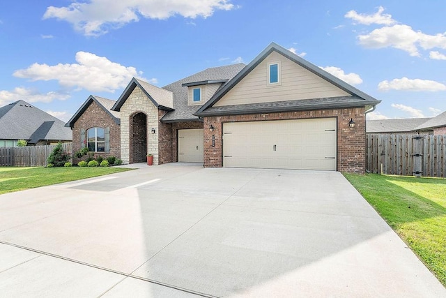 1904 Bergman Rd, Pea Ridge, AR 72751 - view of front facade with brick siding, driveway, an attached garage, and a shingled roof