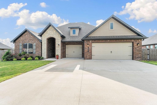 1904 Bergman Rd, Pea Ridge, AR 72751 - view of front of house featuring brick siding, concrete driveway, a garage, and roof with shingles