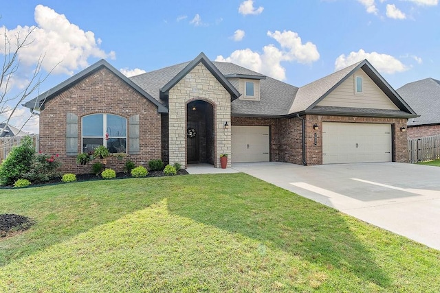 1904 Bergman Rd, Pea Ridge, AR 72751 - french country home with brick siding, roof with shingles, a garage, driveway, and stone siding