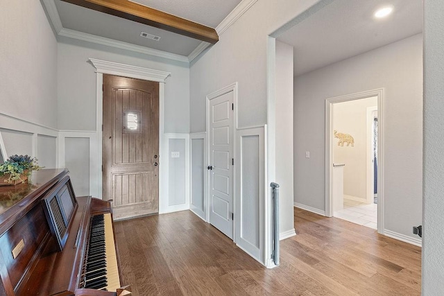 1904 Bergman Rd, Pea Ridge, AR 72751 - foyer entrance with beam ceiling, wood finished floors, wainscoting, and a decorative wall