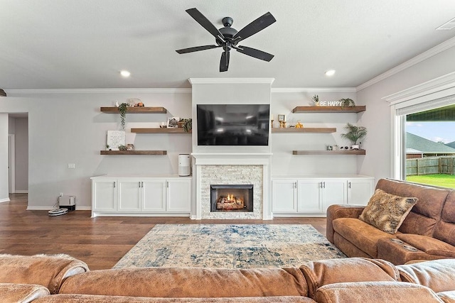 1904 Bergman Rd, Pea Ridge, AR 72751 - living area featuring crown molding, dark wood-style flooring, a fireplace, ceiling fan, and recessed lighting