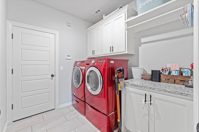 1904 Bergman Rd, Pea Ridge, AR 72751 - washroom with cabinet space, washing machine and dryer, light tile patterned floors, and baseboards