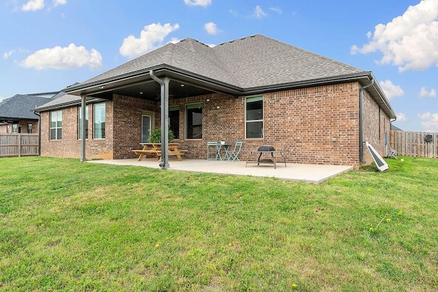 1904 Bergman Rd, Pea Ridge, AR 72751 - back of property with brick siding, a patio area, and a shingled roof