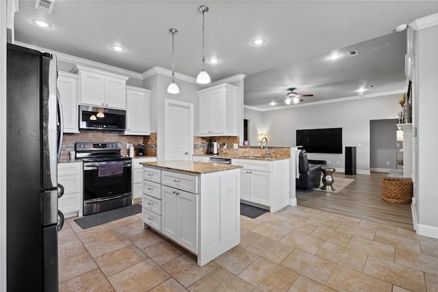 236 Ranalli Ave, Springdale, AR 72762 - kitchen with stainless steel appliances, open floor plan, ornamental molding, ceiling fan, and tasteful backsplash