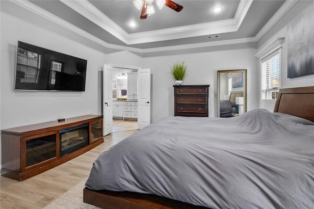 236 Ranalli Ave, Springdale, AR 72762 - bedroom with a raised ceiling, light wood-type flooring, ornamental molding, ensuite bath, and ceiling fan