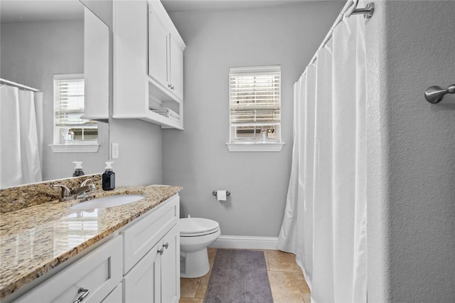 236 Ranalli Ave, Springdale, AR 72762 - bathroom with vanity, healthy amount of natural light, tile patterned flooring, and a shower with shower curtain