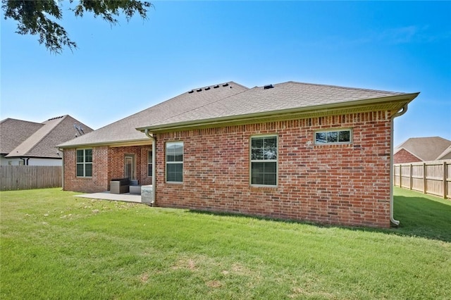 236 Ranalli Ave, Springdale, AR 72762 - rear view of house featuring a fenced backyard, brick siding, a patio area, and a shingled roof