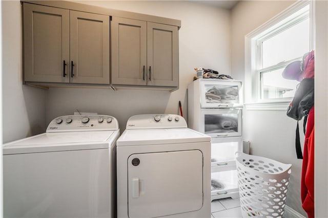 2009 Poppy St, Bentonville, AR 72713 - laundry room with separate washer and dryer, cabinet space, and light tile patterned floors