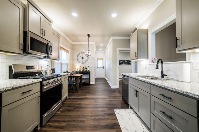 2009 Poppy St, Bentonville, AR 72713 - kitchen featuring appliances with stainless steel finishes, gray cabinets, a sink, crown molding, and baseboards