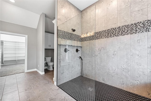 2707 W Lilac St, Rogers, AR 72758 - full bath featuring a stall shower, toilet, baseboards, and tile patterned flooring
