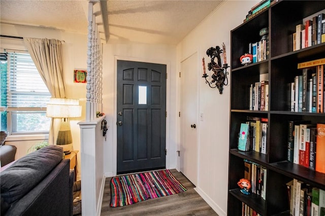 5 Chapel Ln, Bella Vista, AR 72715 - entryway with wood finished floors, a textured ceiling, and baseboards